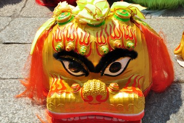 Closeup of a Lion dance mask on the ground